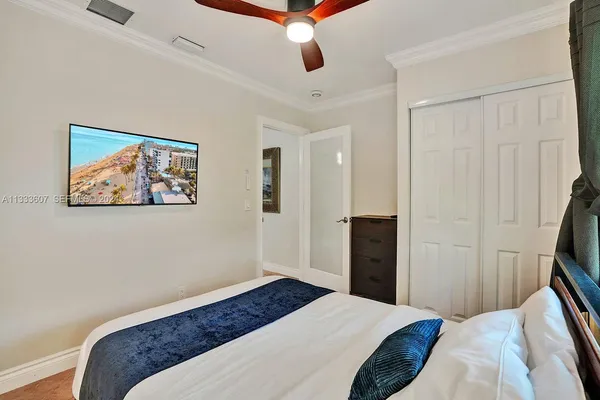 a bedroom with a bed and a walk in closet