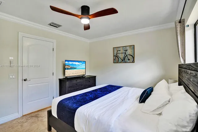 a bedroom with a bed and a view of bathroom