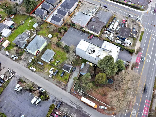 an aerial view of a residential apartment building with a yard