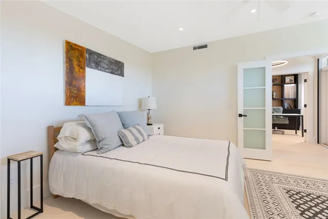 a bedroom with a bed and a couch