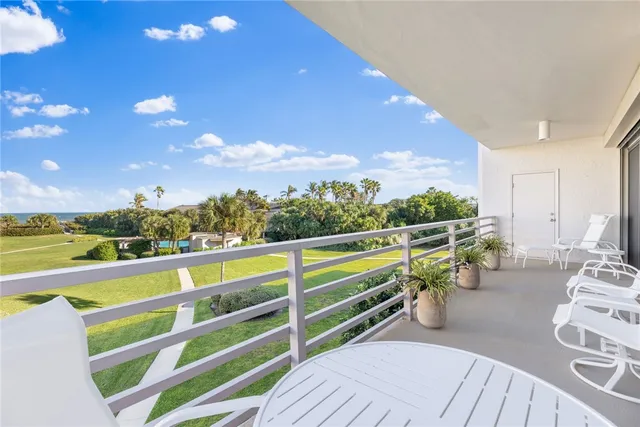 a view of a balcony with chairs