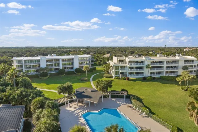 a view of a swimming pool with lounge chair