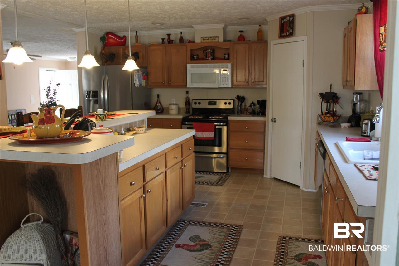 9380 Spice Pond Road Eight Mile, AL 36613 - Photo 24 of 36 Ample counter space and large walk-in pantry.