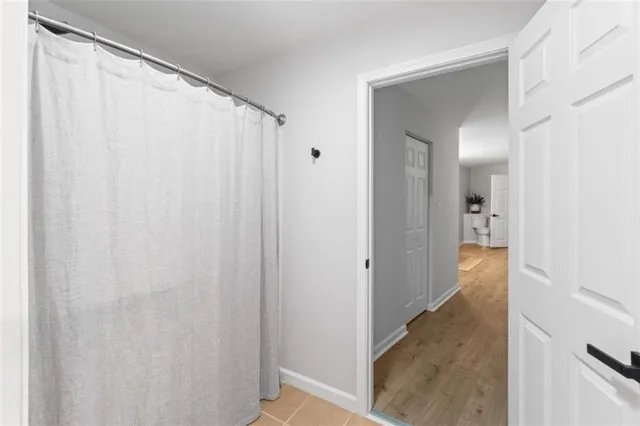 a view of a hallway with a room