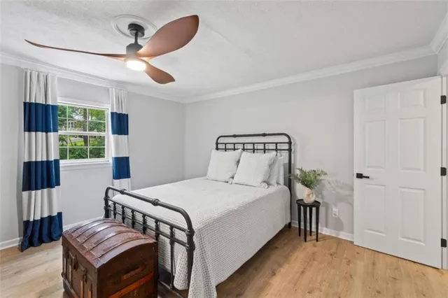 a view of a hallway with wooden floor and a glass door