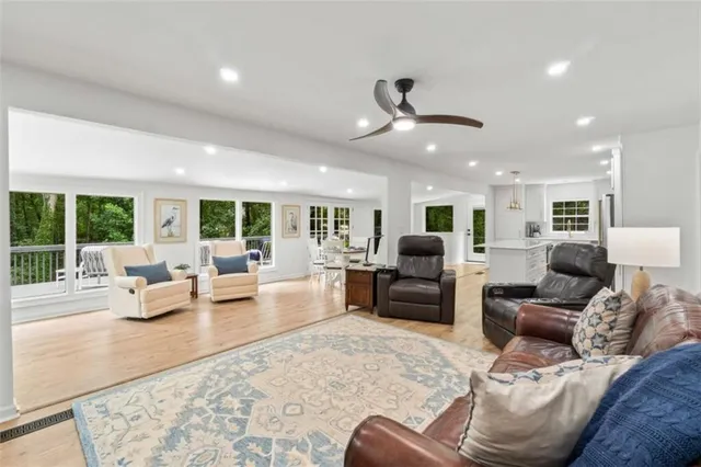a living room with a fireplace and a flat screen tv