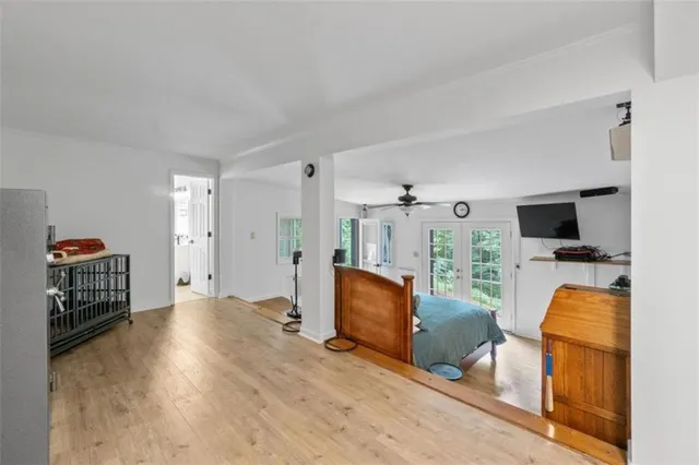 a bathroom with a tub a double vanity sink and mirror