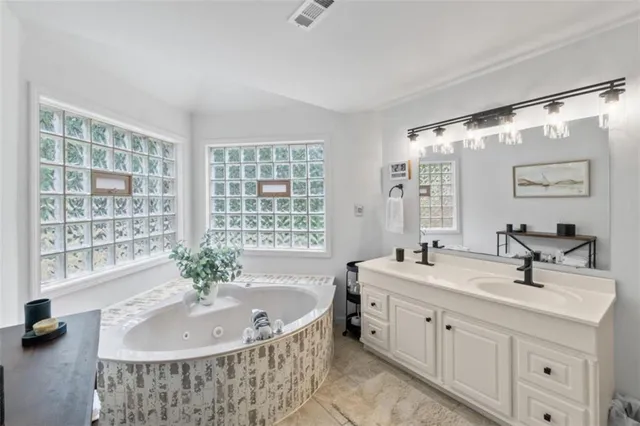 a bathroom with a shower and a glass door