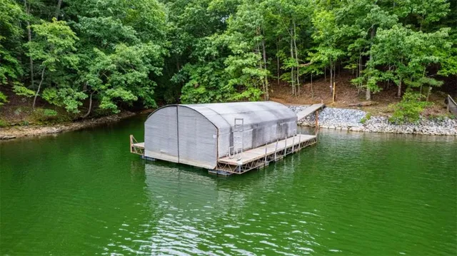 a view of deck with table and chairs and wooden floor