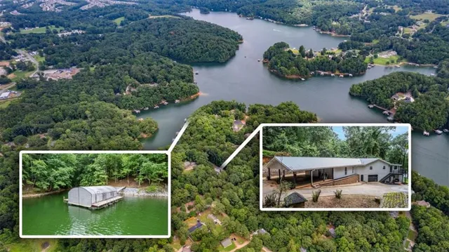an aerial view of house with yard swimming pool and outdoor seating