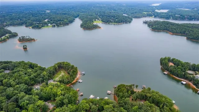 an aerial view of a house with ocean view