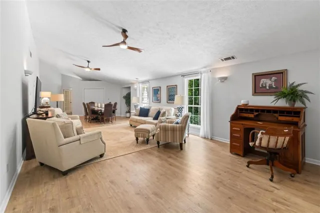 a living room with furniture or couch and a wooden floor