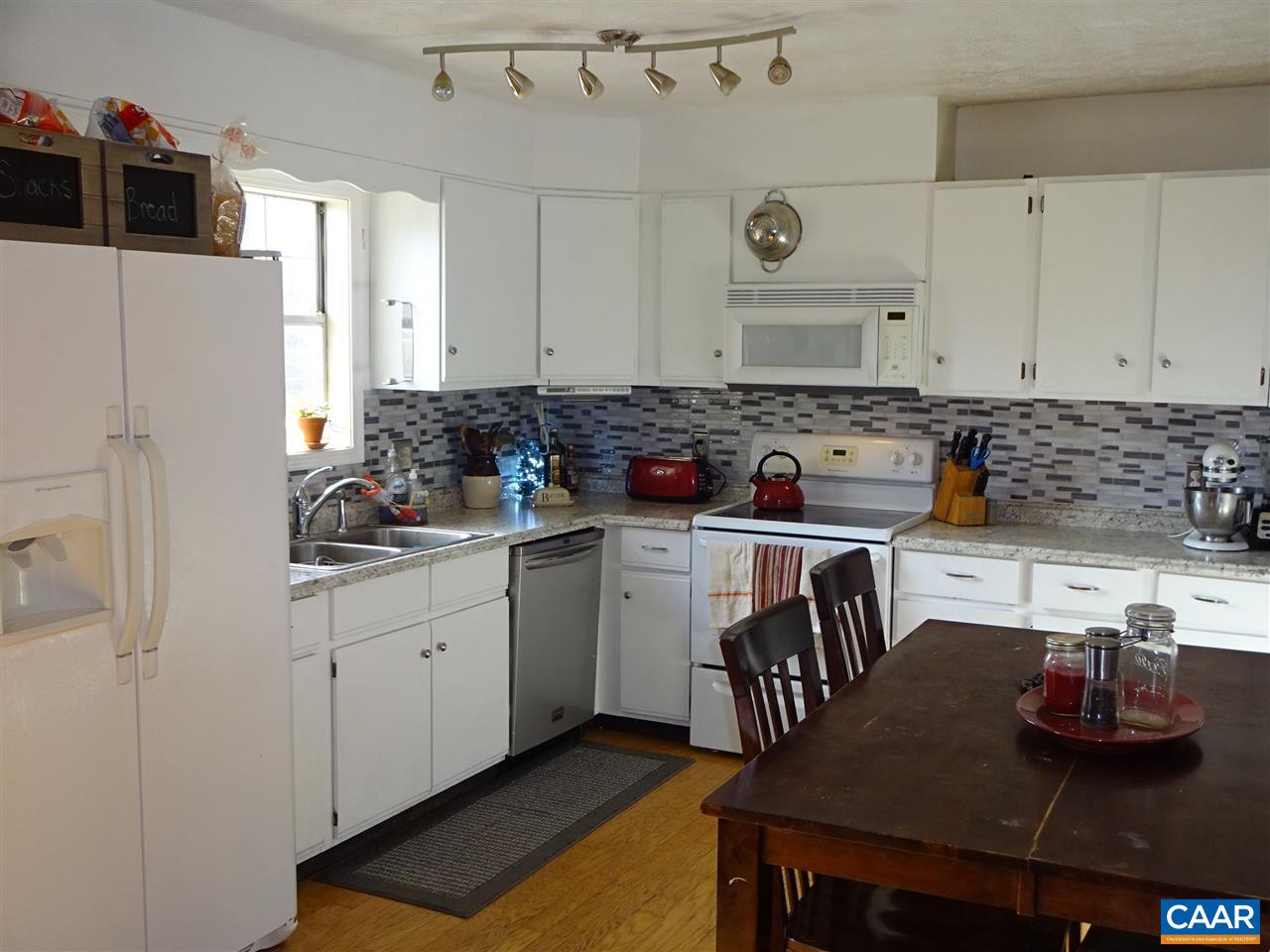1119 Hollands Road Palmyra, VA 22963 - Photo 5 of 17 a kitchen with stainless steel appliances granite countertop a stove and a refrigerator