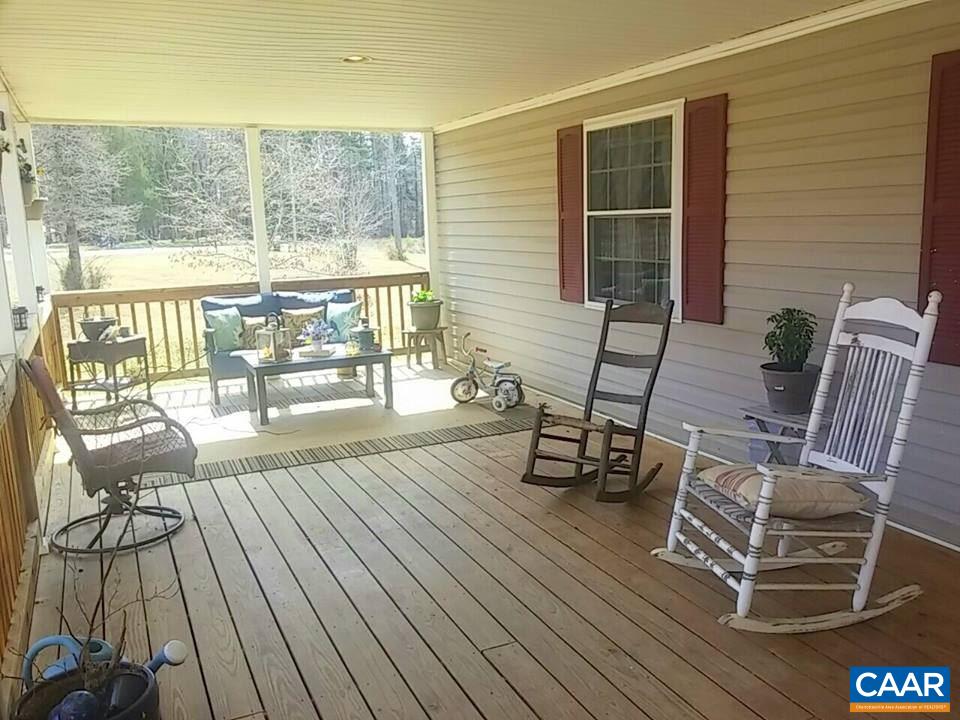 1119 Hollands Road Palmyra, VA 22963 - Photo 10 of 17 a view of a chairs and table on the wooden floor