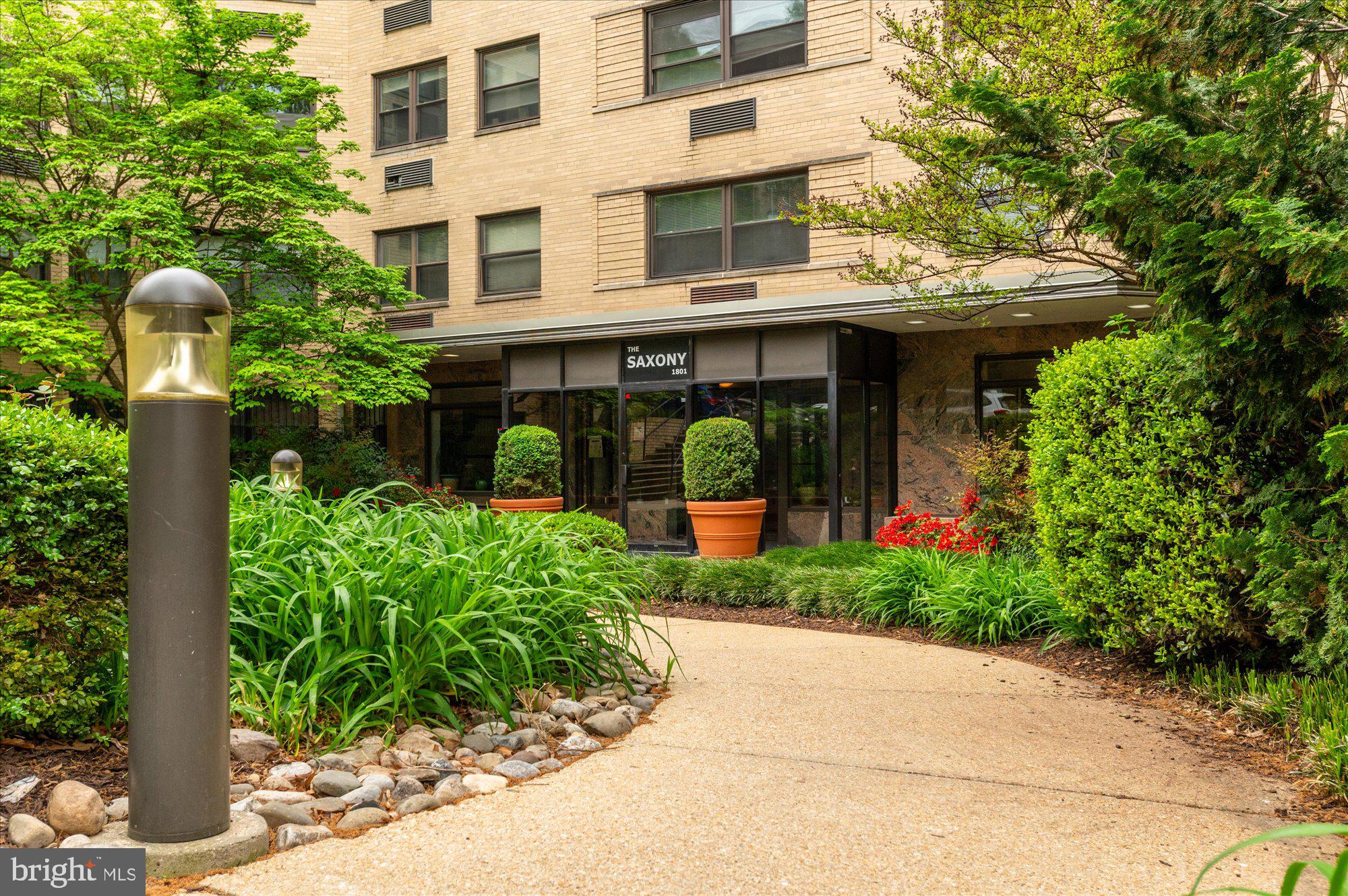1801 Clydesdale Place Northwest, Unit 505 Washington, DC 20009 - Photo 15 of 21 a view of a building with garden and plants