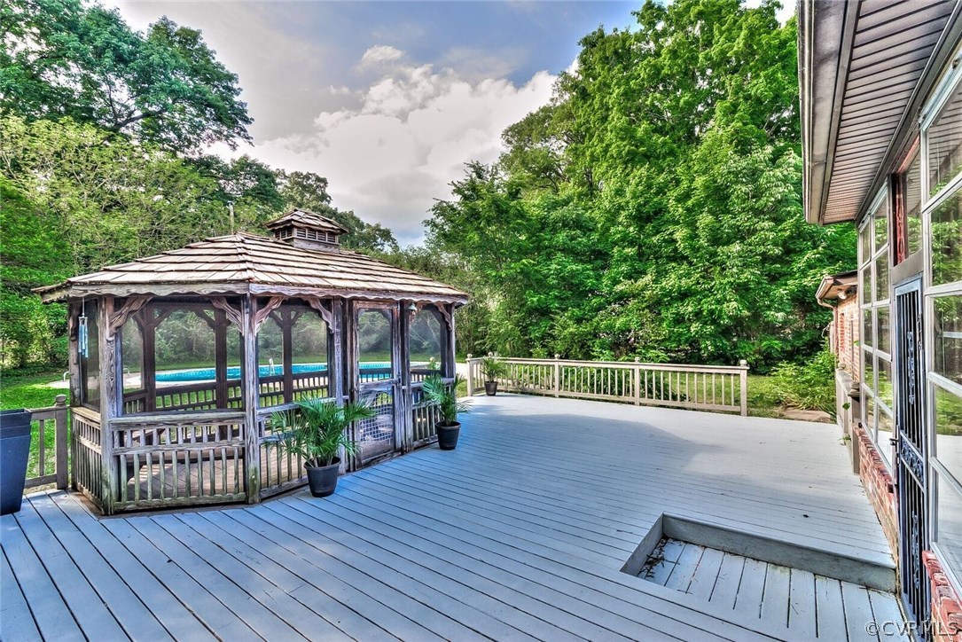 6008 Brookfield Road Richmond, VA 23227 - Photo 12 of 28 a view of a deck with furniture and wooden deck