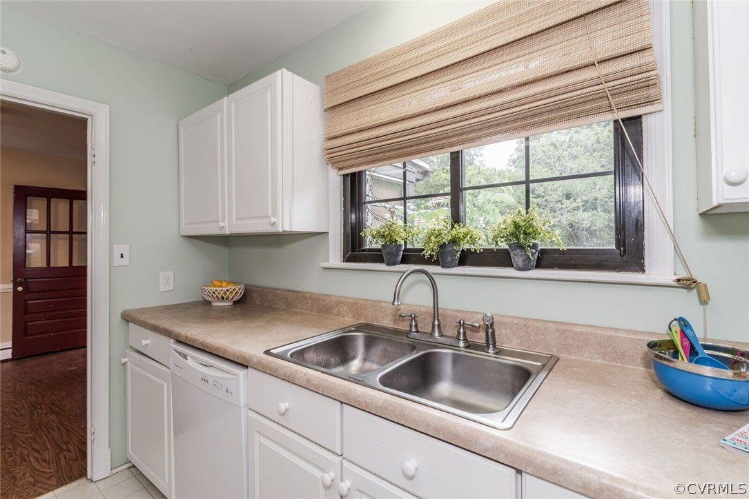6008 Brookfield Road Richmond, VA 23227 - Photo 16 of 28 a kitchen with sink a window and cabinets