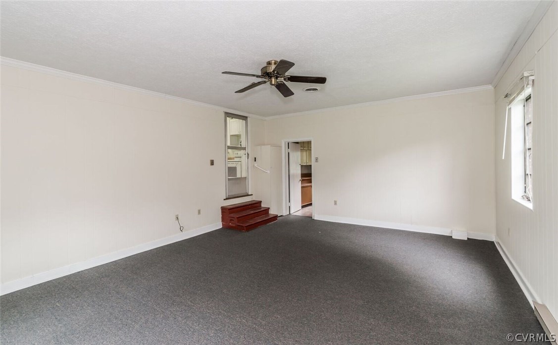 6008 Brookfield Road Richmond, VA 23227 - Photo 25 of 28 an empty room with windows and fan