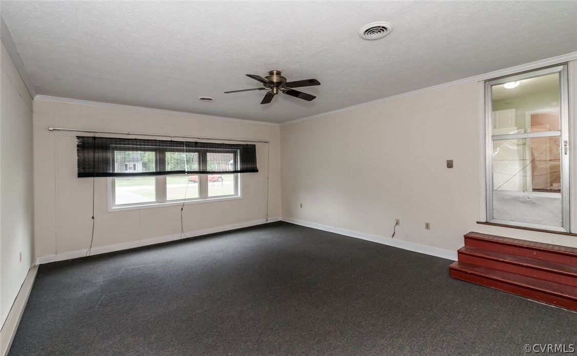 6008 Brookfield Road Richmond, VA 23227 - Photo 26 of 28 an empty room with windows and ceiling fan