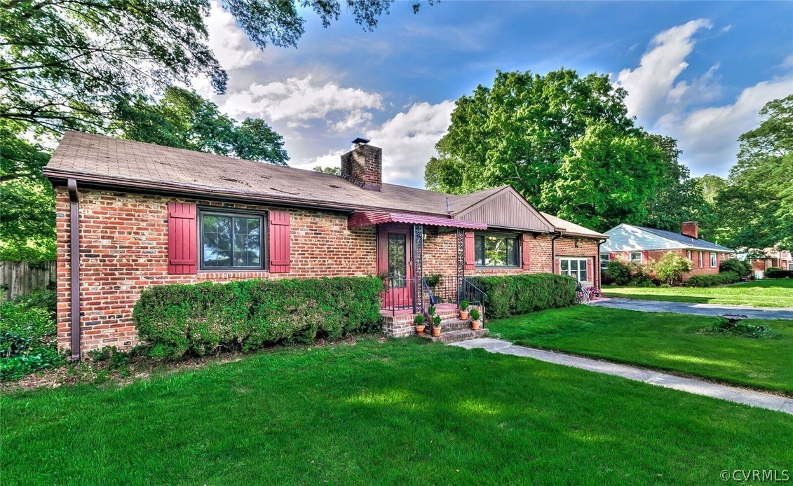 6008 Brookfield Road Richmond, VA 23227 - Photo 3 of 28 a front view of a house with a yard
