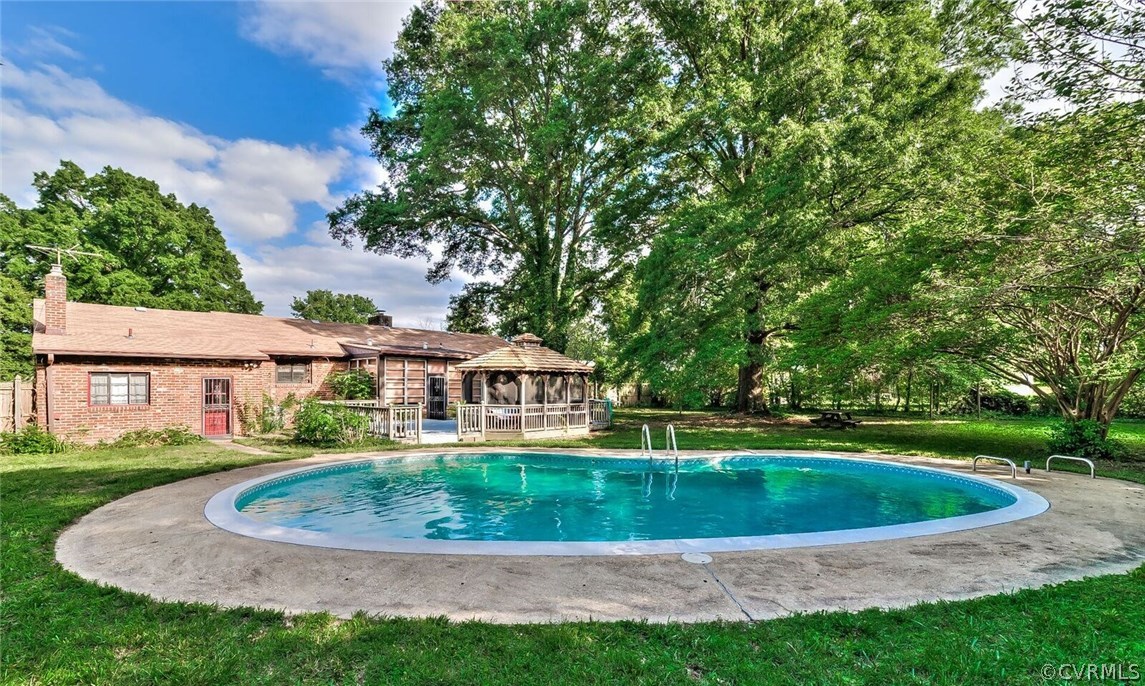 6008 Brookfield Road Richmond, VA 23227 - Photo 5 of 28 a view of a house with a swimming pool