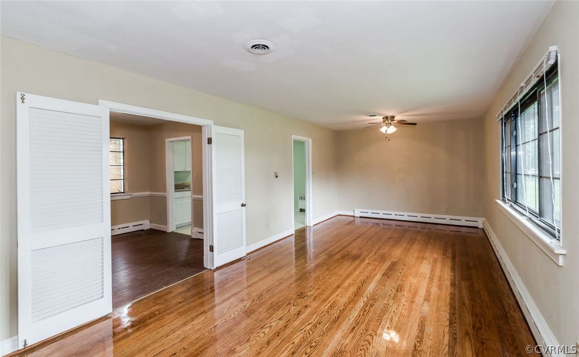 6008 Brookfield Road Richmond, VA 23227 - Photo 7 of 28 wooden floor in an empty room with a window