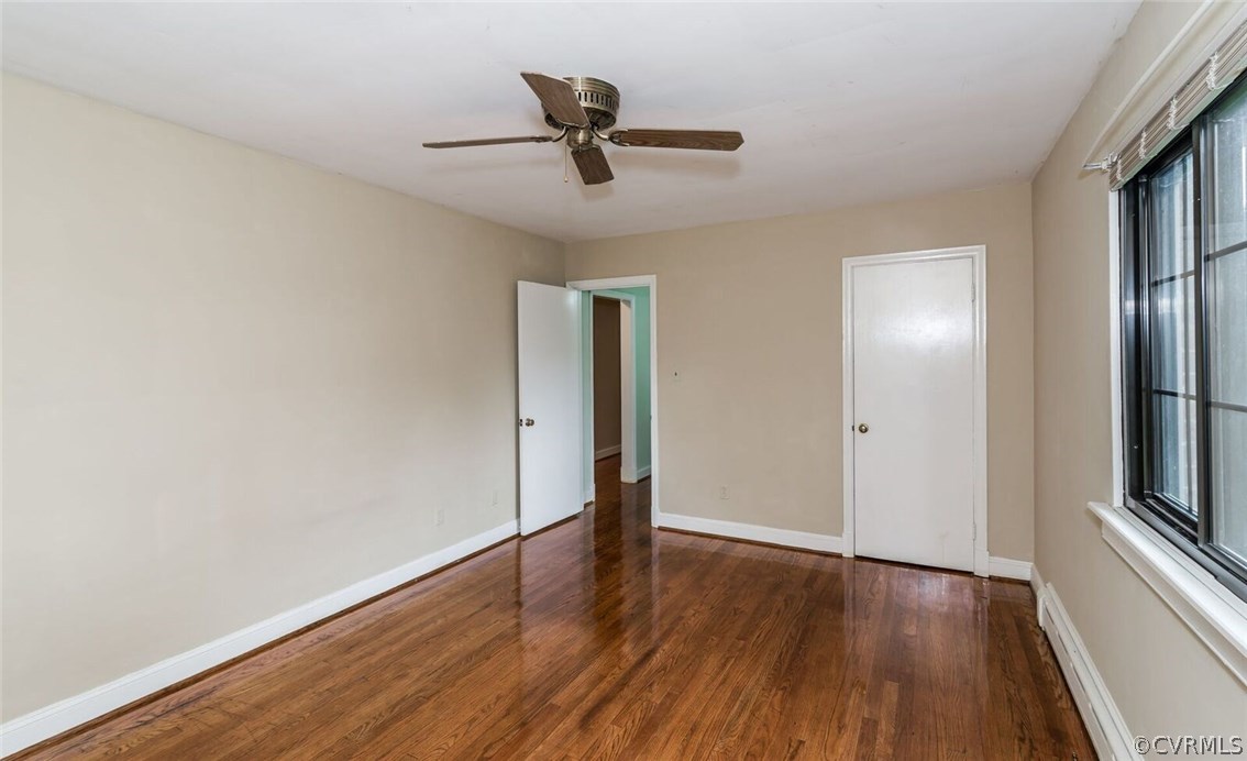 6008 Brookfield Road Richmond, VA 23227 - Photo 9 of 28 a view of empty room with wooden floor and fan