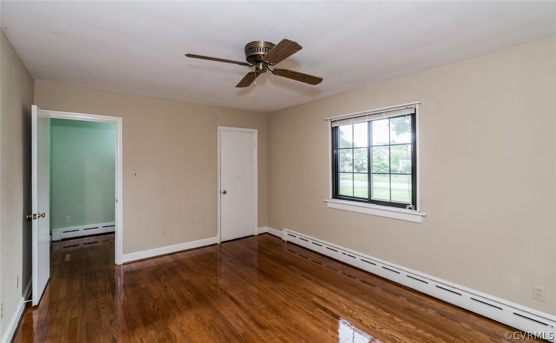 6008 Brookfield Road Richmond, VA 23227 - Photo 10 of 28 a view of empty room with wooden floor and fan