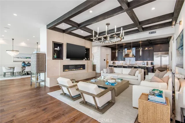 a kitchen with a table chairs refrigerator and wooden cabinets