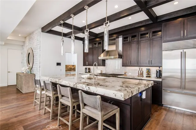a kitchen with stainless steel appliances granite countertop lots of counter top space a sink and cabinets