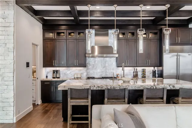 a kitchen with a white cabinets and a window
