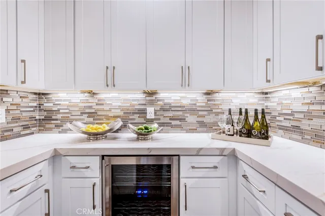 a view of a dining room with furniture a chandelier and wooden floor