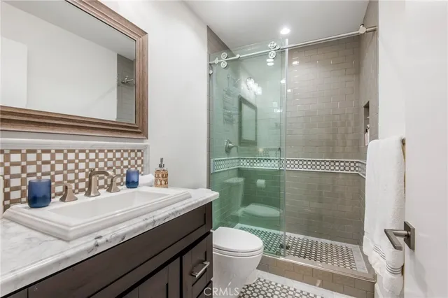 a living room with furniture a large window and a table