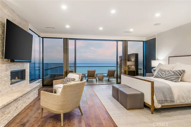 a roof deck with a potted plant and outdoor seating