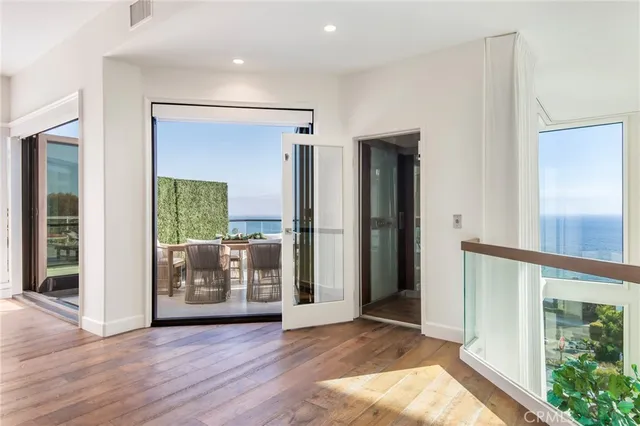 a view of a chairs and table in patio