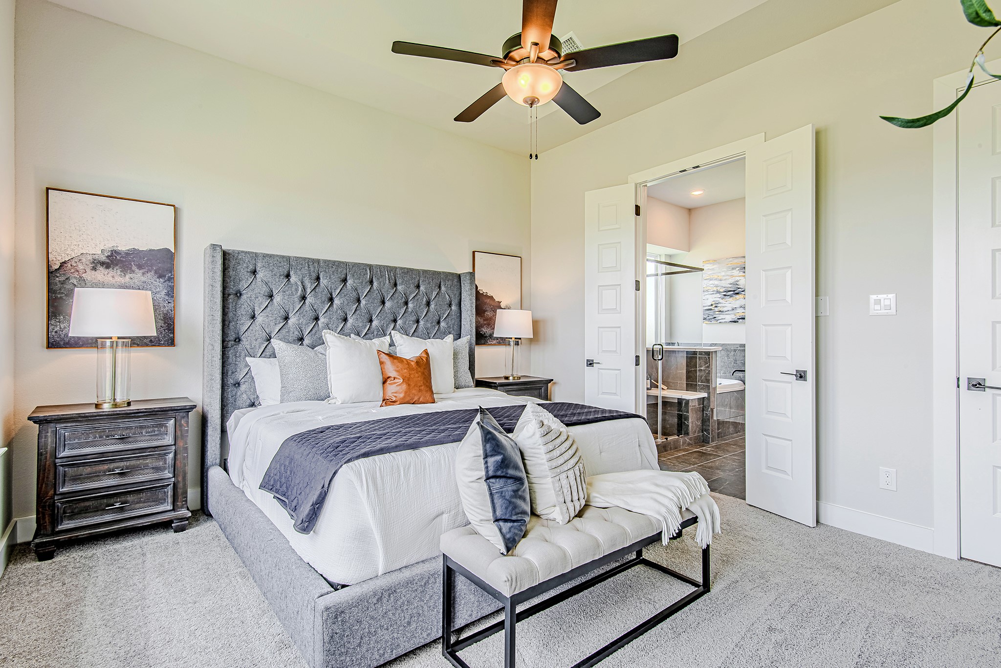 141 Peninsula Point Drive Montgomery, TX 77356 - Photo 20 of 47 The primary bedroom leads into a luxurious en-suite bath through double doors, creating a true private sanctuary.
