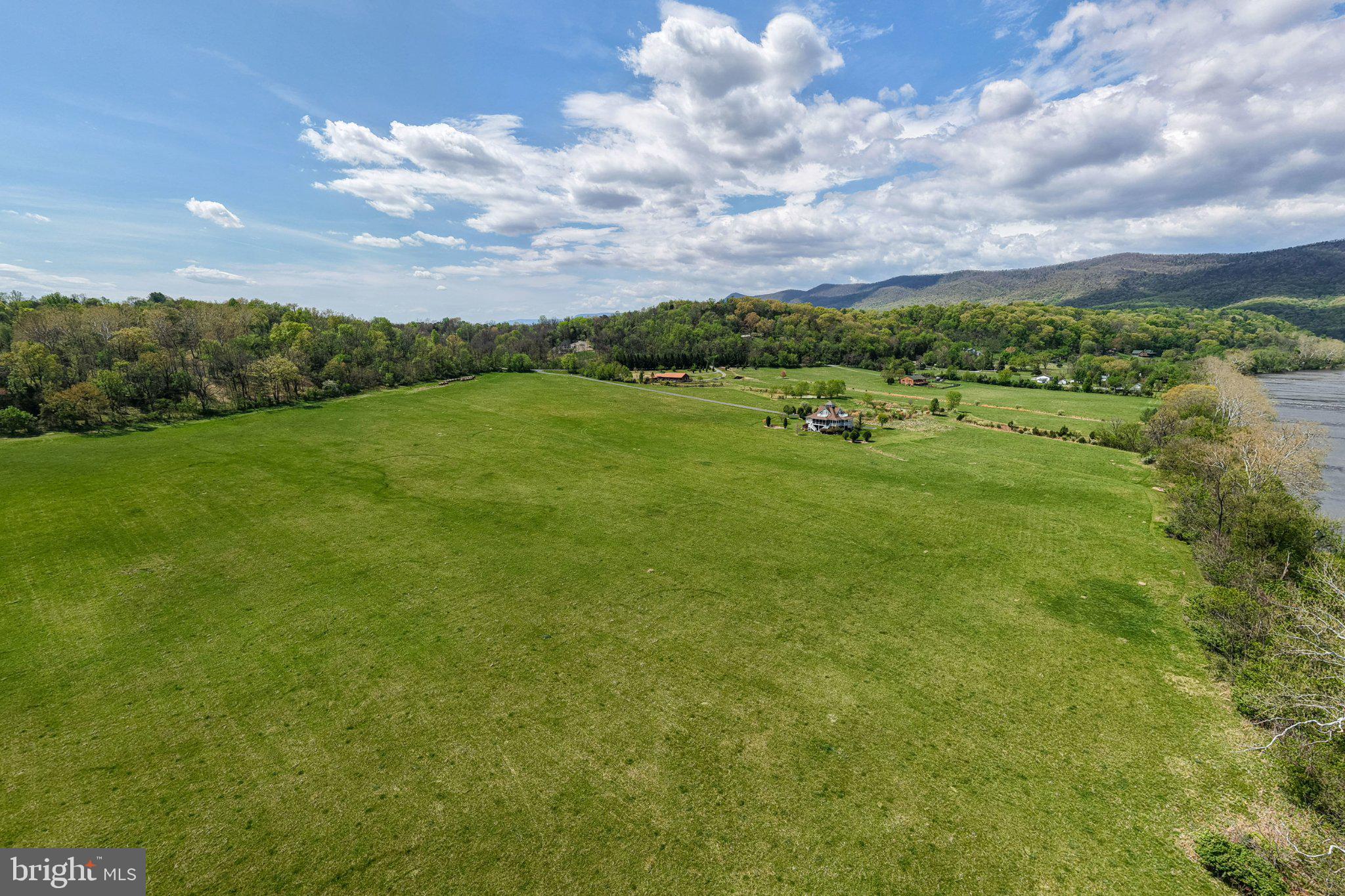 0 Good Mill Road Rileyville, VA 22650 - Photo 35 of 51 Expansive green landscape under blue skies.