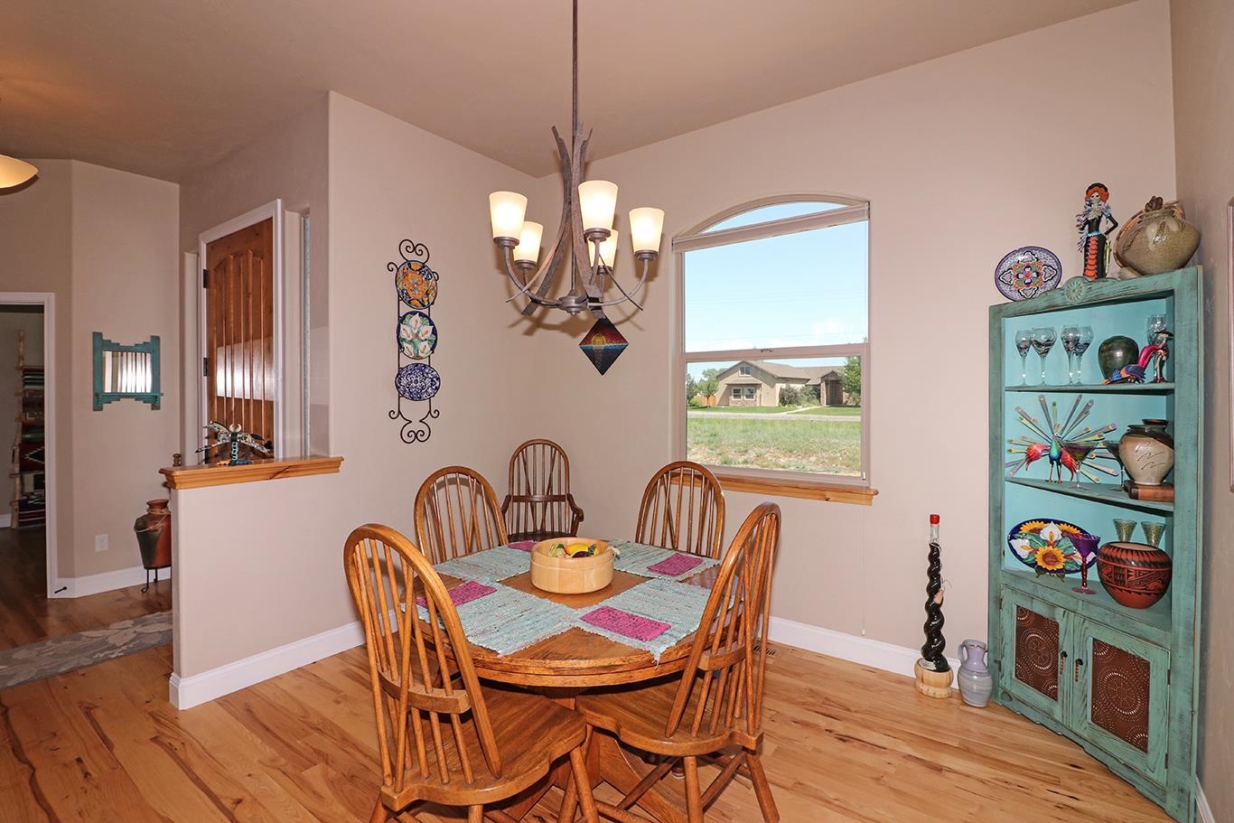 1983 J Road Fruita, CO 81521 - Photo 11 of 42 a view of a dining room with furniture and wooden floor