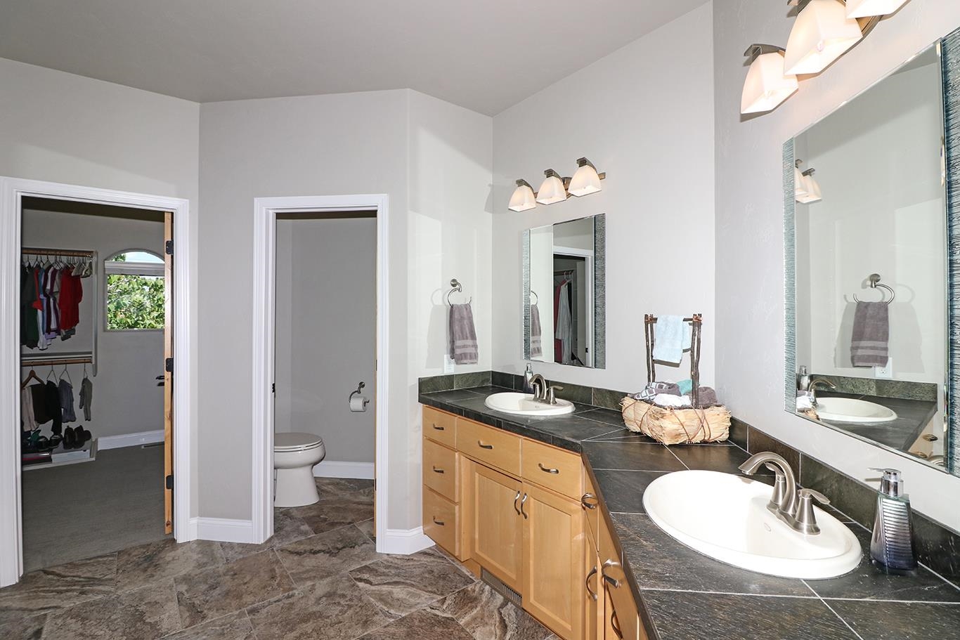 1983 J Road Fruita, CO 81521 - Photo 15 of 42 a spacious bathroom with a granite countertop sink toilet and shower