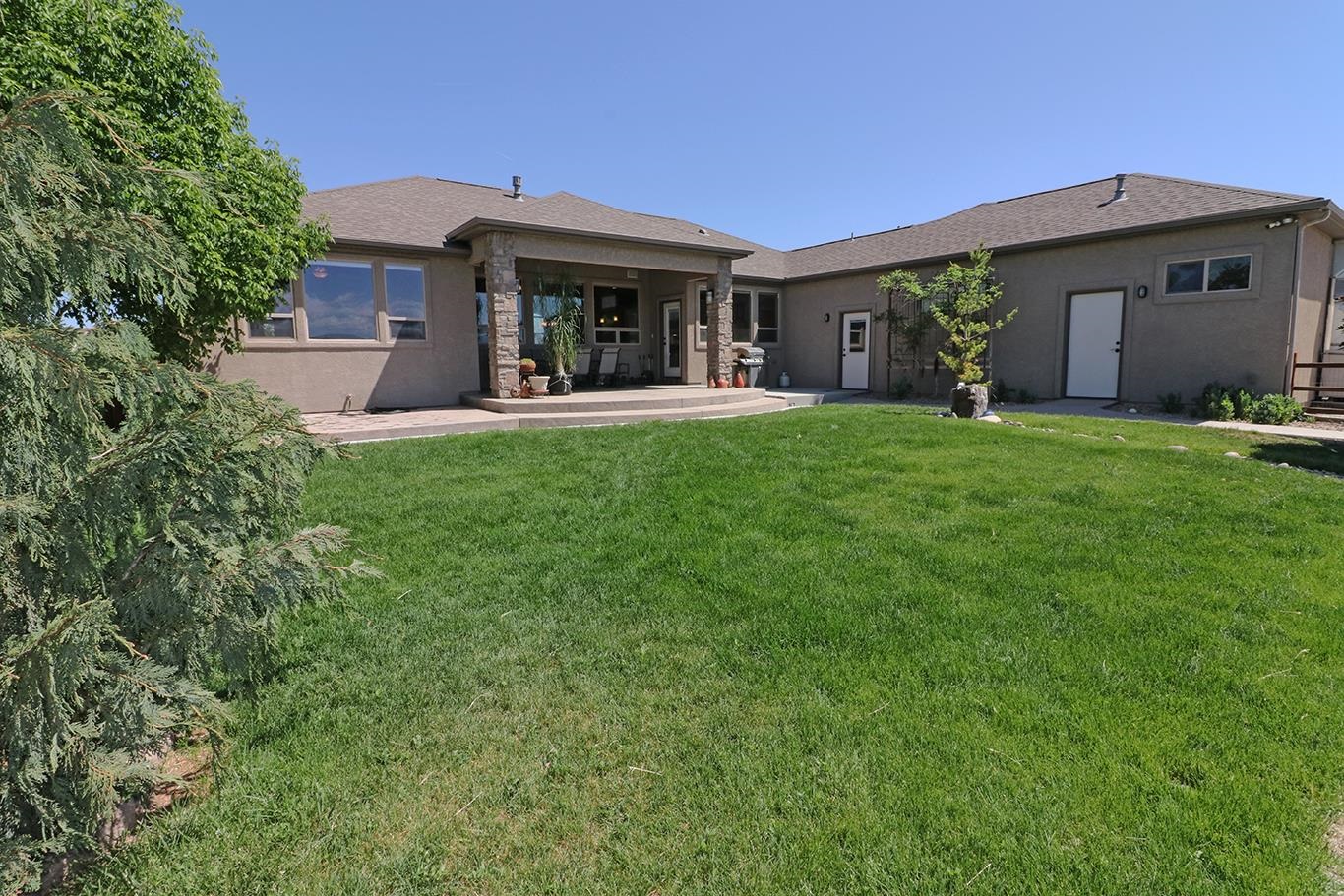 1983 J Road Fruita, CO 81521 - Photo 29 of 42 a view of a house with a yard
