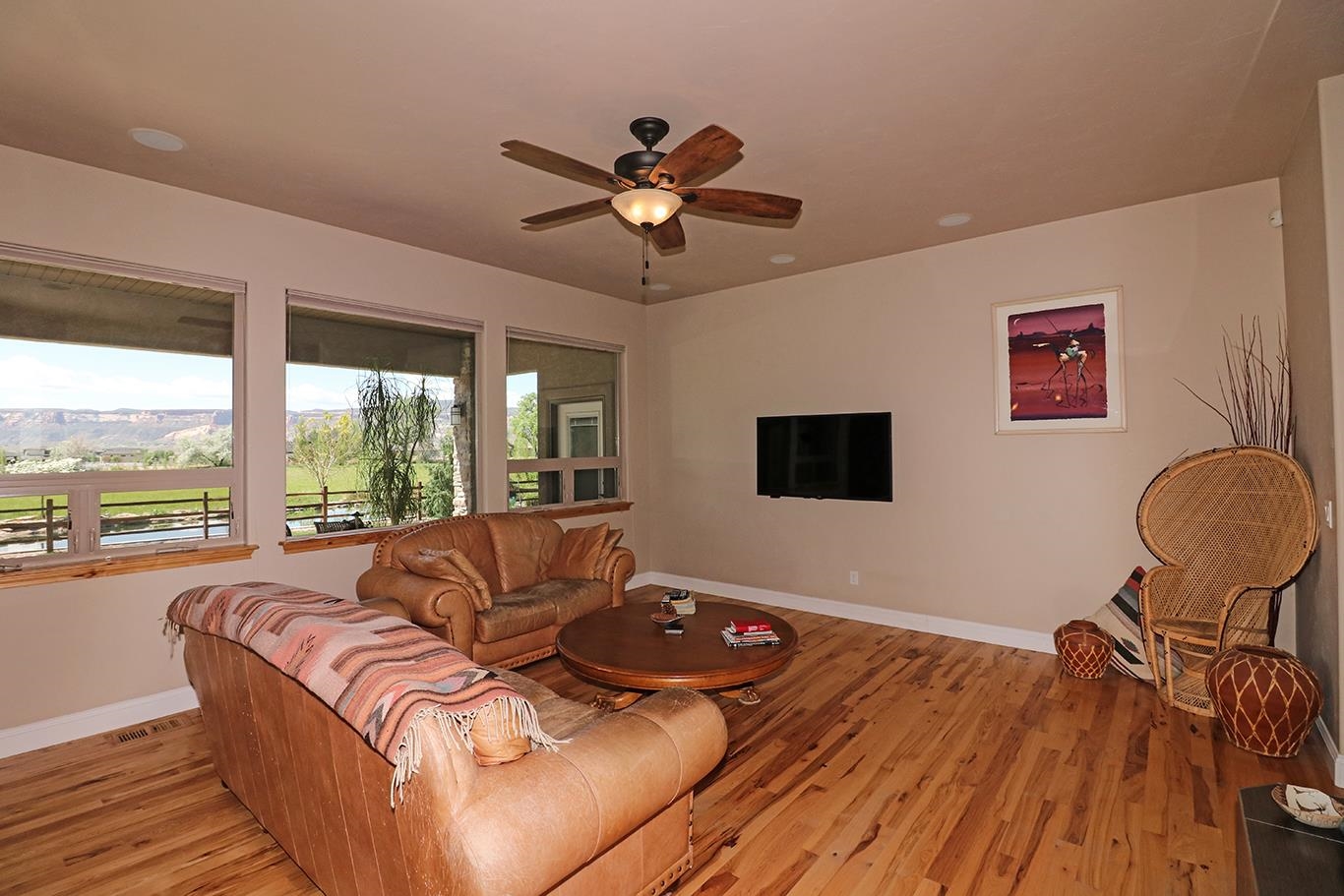 1983 J Road Fruita, CO 81521 - Photo 3 of 42 a living room with furniture and a flat screen tv