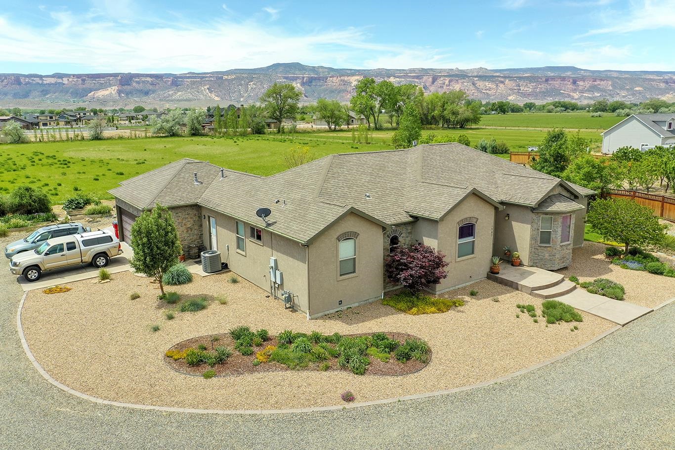 1983 J Road Fruita, CO 81521 - Photo 35 of 42 an aerial view of a house with garden space and mountain view in back