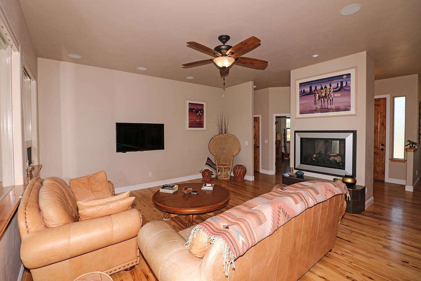 1983 J Road Fruita, CO 81521 - Photo 4 of 42 a living room with furniture flat screen tv and a fireplace