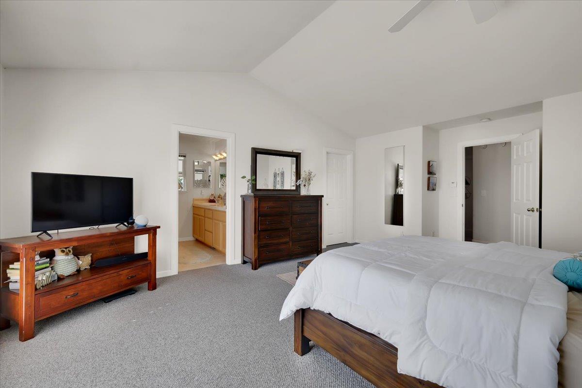 16153 Janet Way Grass Valley, CA 95949 - Photo 17 of 38 a spacious bedroom with a bed and a flat screen tv