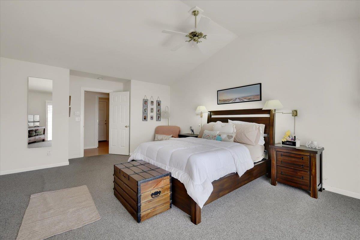 16153 Janet Way Grass Valley, CA 95949 - Photo 18 of 38 a spacious bedroom with a bed and a lamp