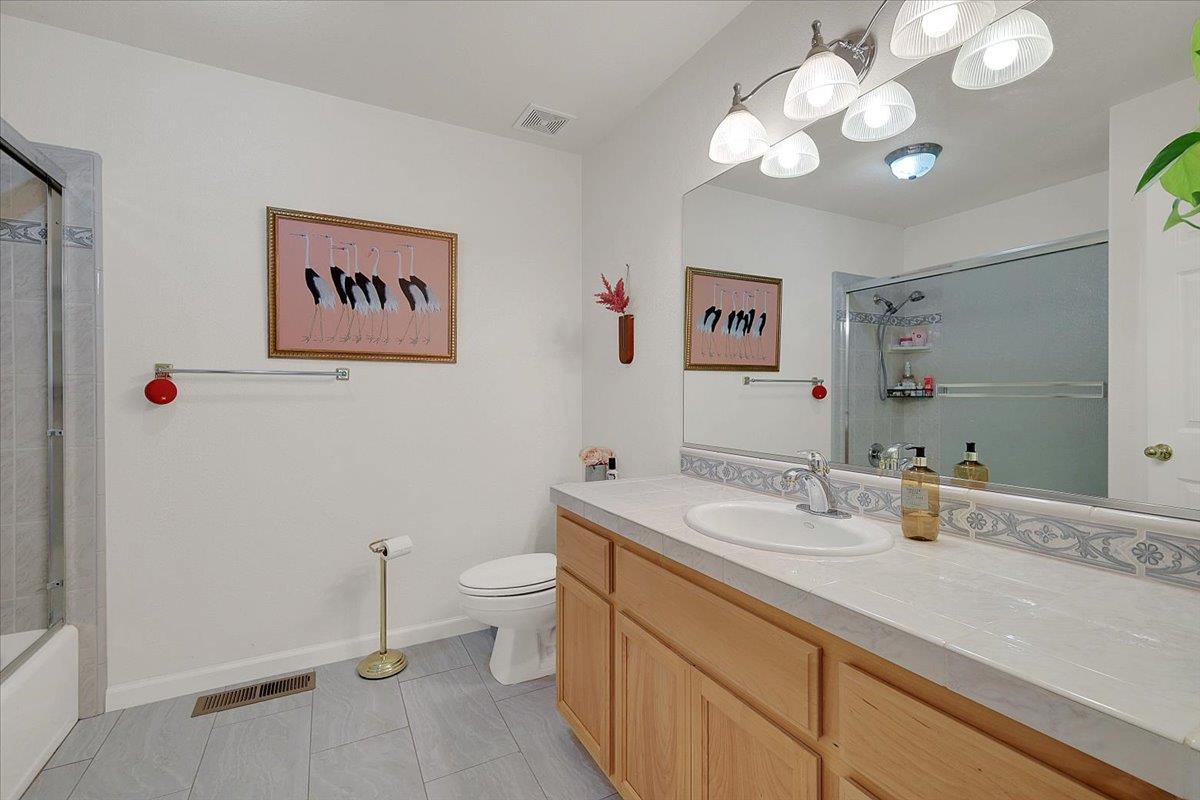 16153 Janet Way Grass Valley, CA 95949 - Photo 22 of 38 a bathroom with a sink a vanity and a mirror