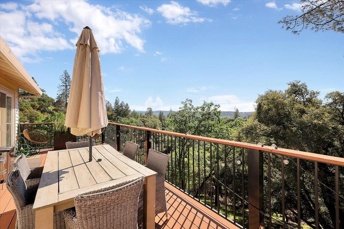 16153 Janet Way Grass Valley, CA 95949 - Photo 27 of 38 a view of a balcony with wooden floor and outdoor seating