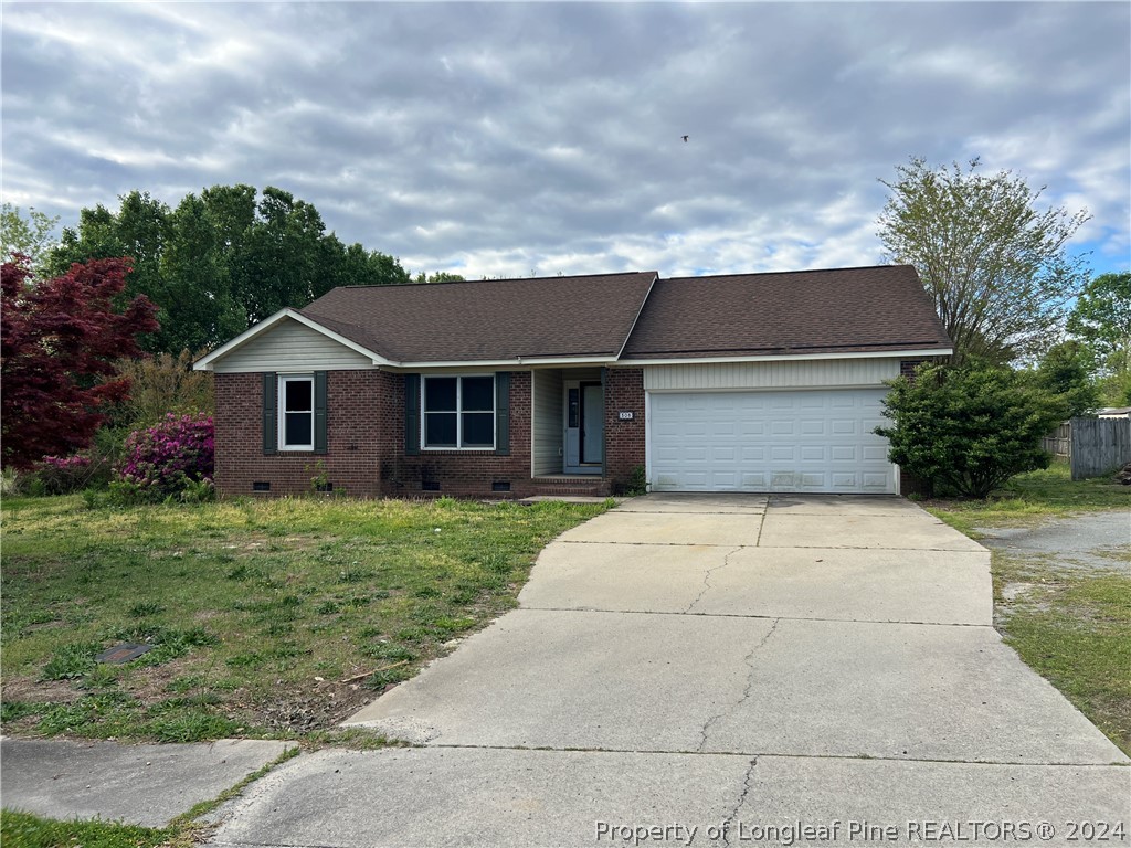 308 Kernstown Road Raeford, NC 28376 - Photo 1 of 15 a front view of a house with a garden