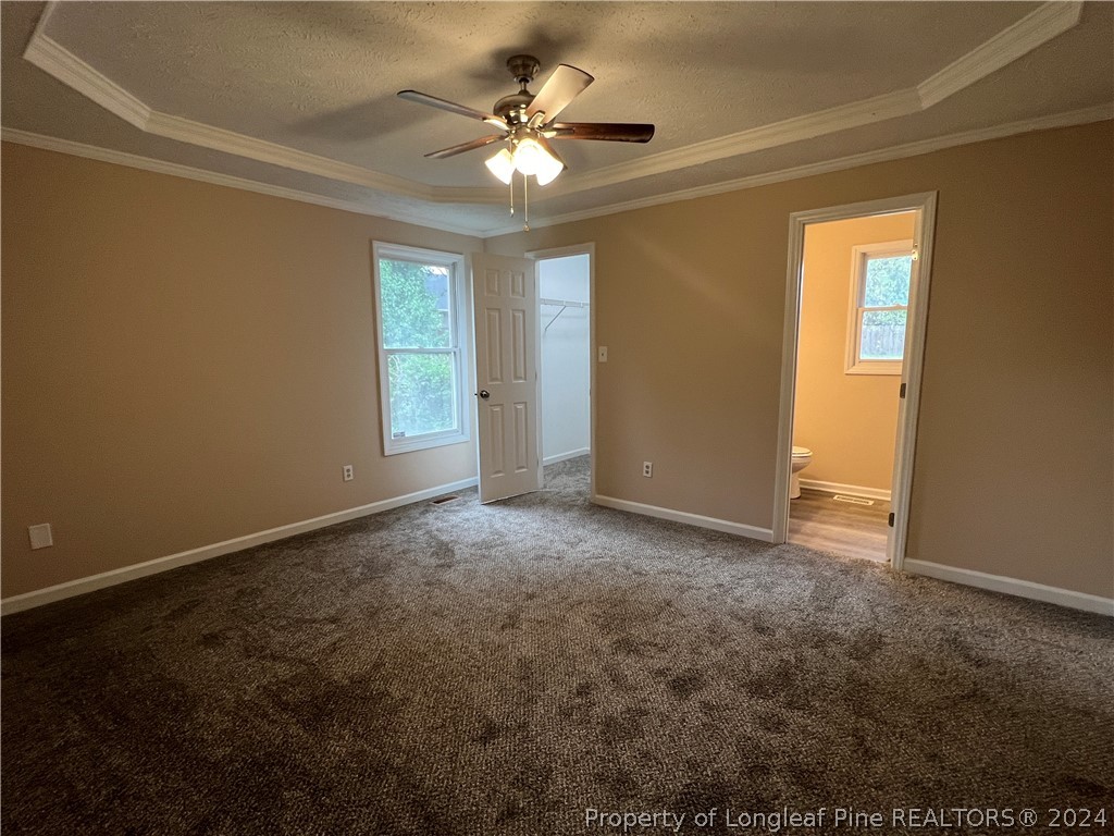 308 Kernstown Road Raeford, NC 28376 - Photo 8 of 15 an empty room with windows and fan