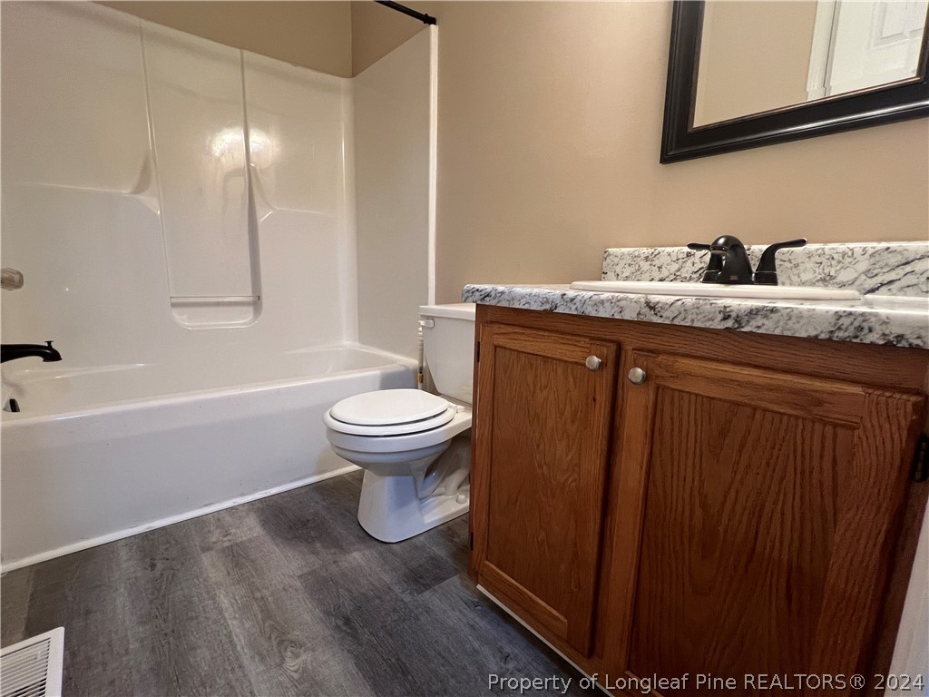 308 Kernstown Road Raeford, NC 28376 - Photo 10 of 15 a bathroom with a sink and a toilet
